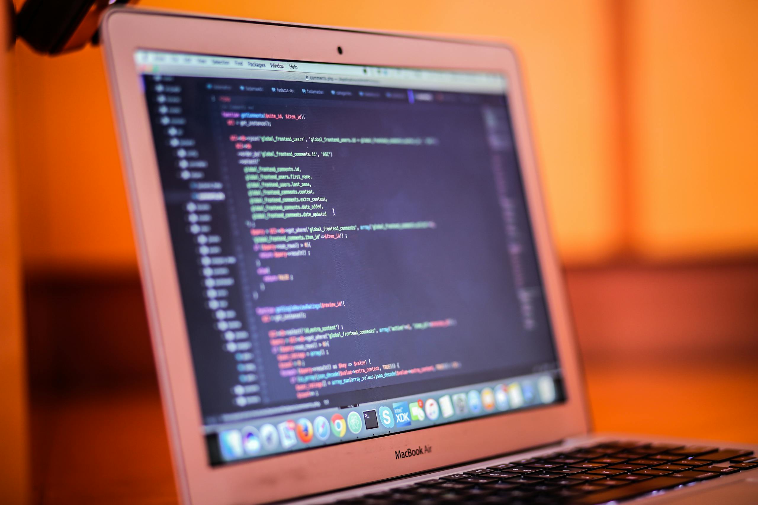 Focused shot of a laptop displaying code, suitable for tech and coding themes.